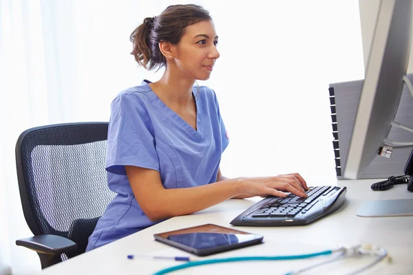 depositphotos_106204460-stock-photo-doctor-working-at-computer-in